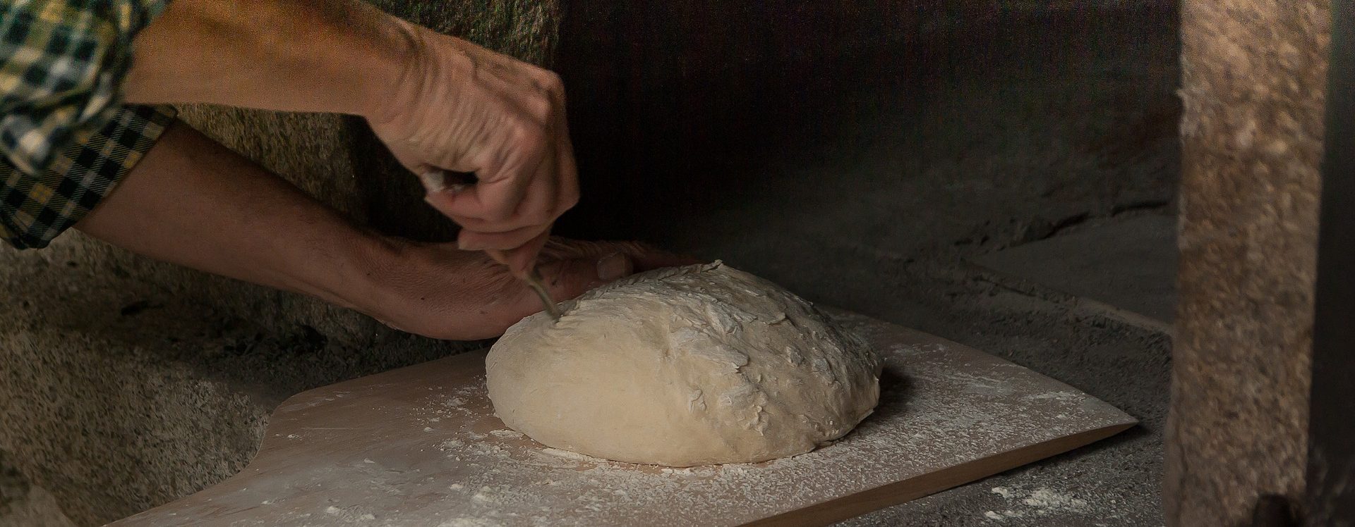 Hand working dough for bread