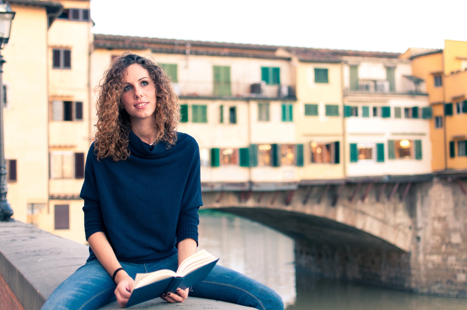 Student with a book near Ponte Vecchio in Florence