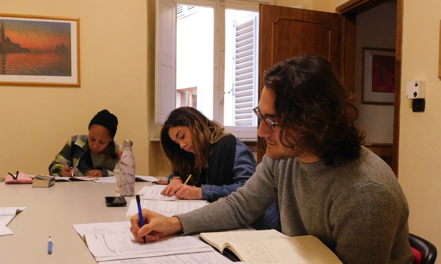 Students learn Italian in a group Italian language course at Parola